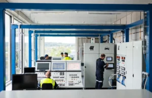 Närkes Elektriska technicians installing smart building automation systems in a modern Swedish facility