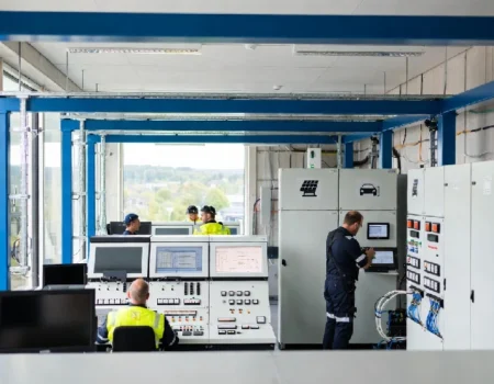 Närkes Elektriska technicians installing smart building automation systems in a modern Swedish facility