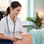 Obstetrician doctor examining pregnant patient in modern clinic, representing Obstetrika care during pregnancy